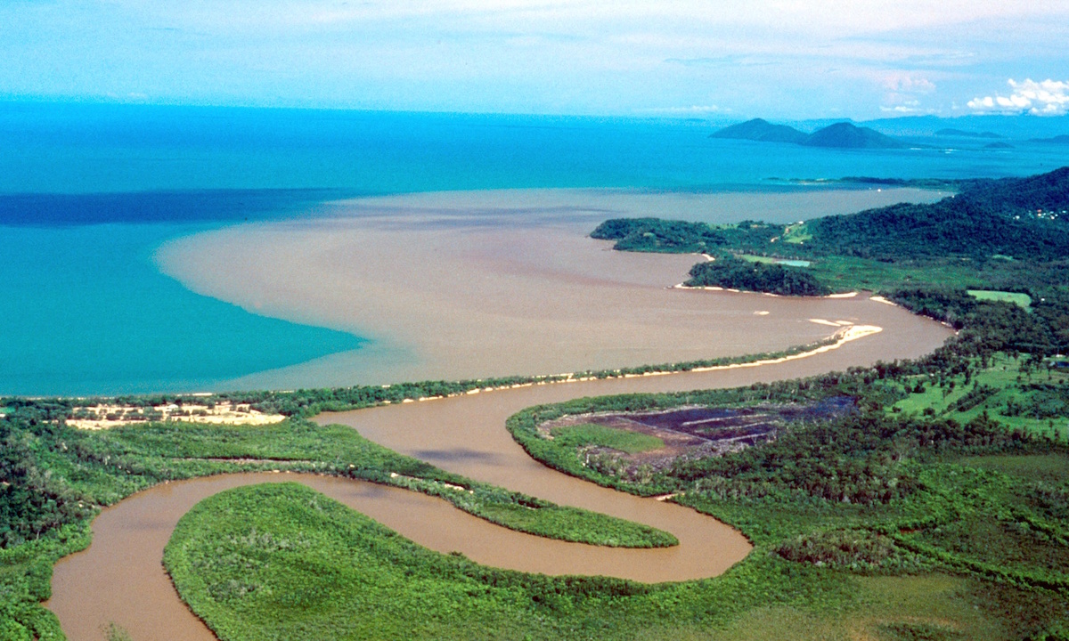 An undated photo shows a flood plume from the Maria Creek heading towards the Great Barrier Reef off Australia's northeastern coast as the Australian government unveiled plans 03 December 2003, to make the Great Barrier Reef the most protected coral reef system on earth. The Zoning Plan for the Great Barrier Reef Marine Park puts a third of the giant coral network off limits to commercial fisherman and tightens restrictions on shipping through the delicate ecosystem. Conservationists have welcomed the move, but warned that the threats to the reef from climate change and land-based pollution still need to be addressed. AFP PHOTO (Photo credit should read STR/AFP/Getty Images)